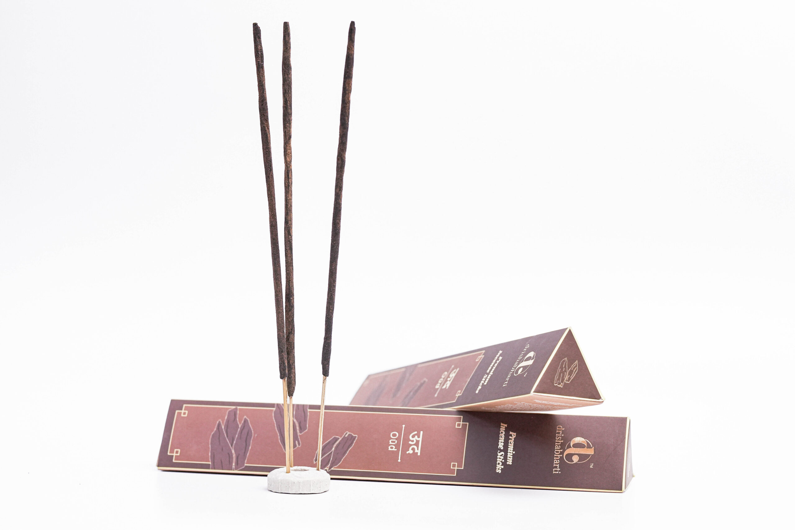 agarbatti product shoot, incense stick photography, brown agarbatti box, luxury incense packaging, e-commerce product photography, white background product photo
