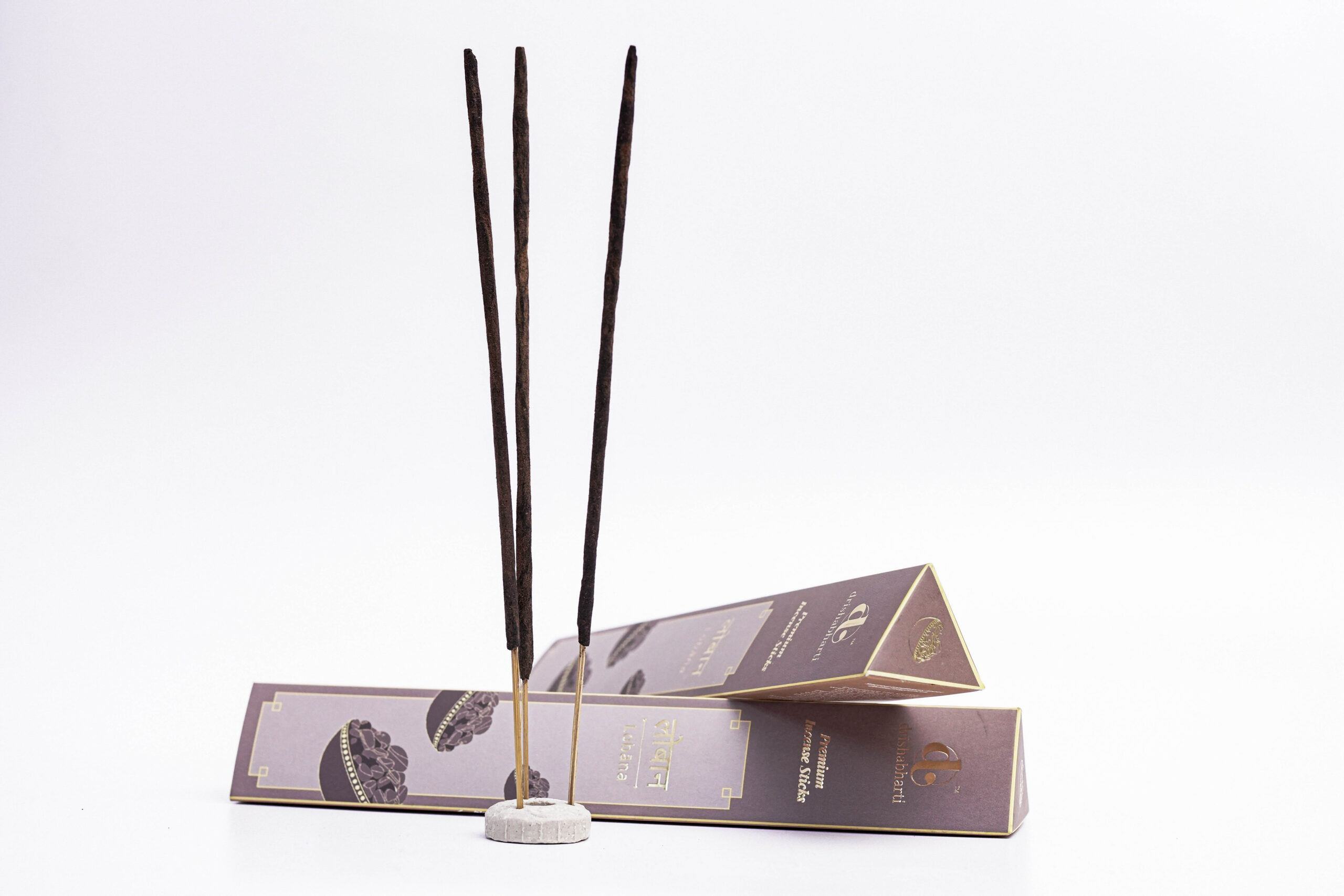 agarbatti product shoot, incense stick photography, brown agarbatti box, luxury incense packaging, e-commerce product photography, white background product