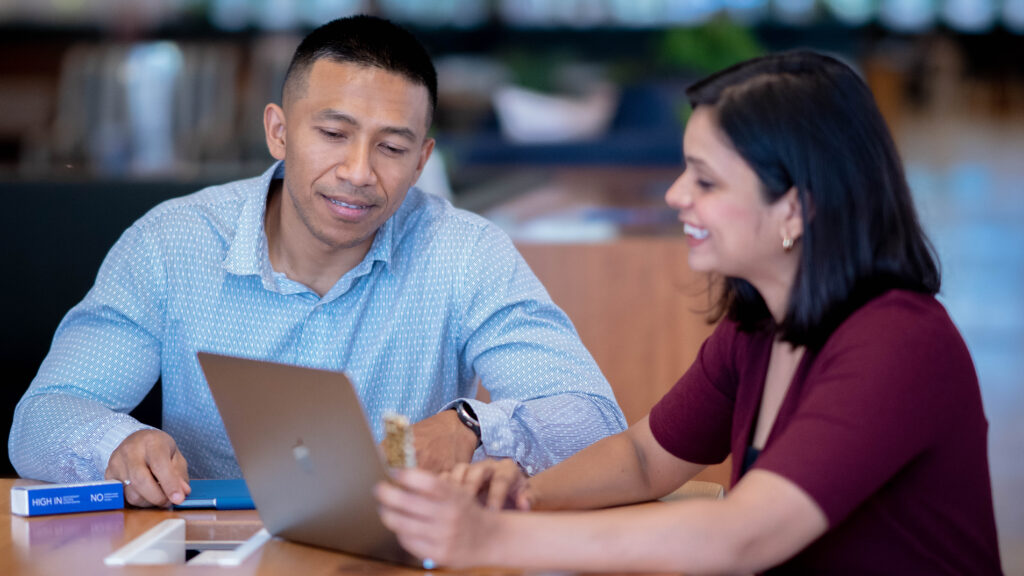 Two colleagues collaborating on laptop corporate photo Mumbai