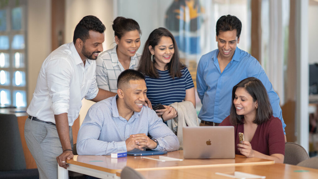 Group of professionals smiling corporate team photo Mumbai