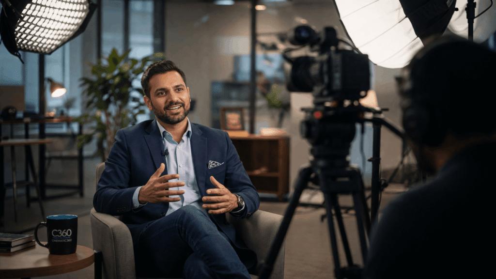 B2B professional being interviewed on camera for testimonial video in office