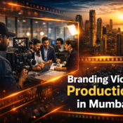 Cinematic branding video production in Mumbai showing videographer filming business team with Mumbai skyline background.