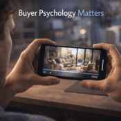 Residential buyer engaged with professional real estate video clip on smartphone showing psychological response to property