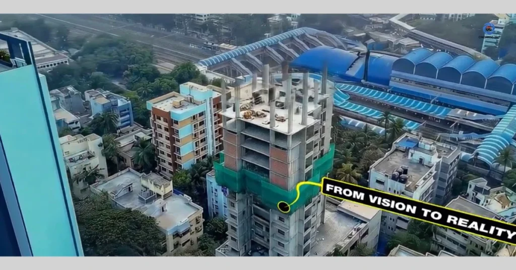 erial drone photograph tracking the structural progress of a high-rise tower under construction in Mumbai next to a railway line, featuring a graphic annotation highlighting the 15th floor and scaffolding setups by Cinematic360.