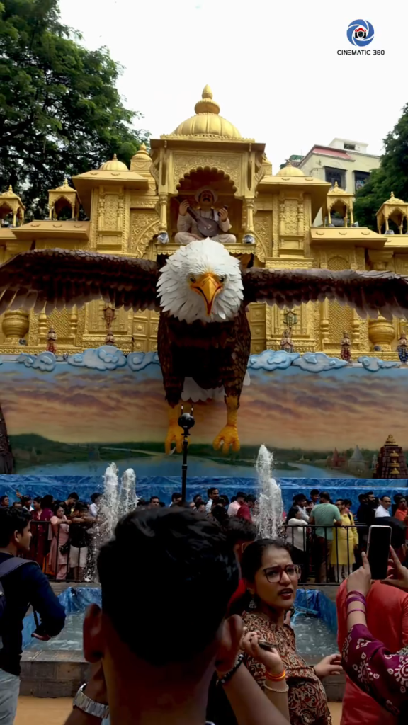 Insta360 Pro 2 on monopod positioned in front of Lalbaug Ganesh festival golden pandal during Cinematic360 360 videography Mumbai production