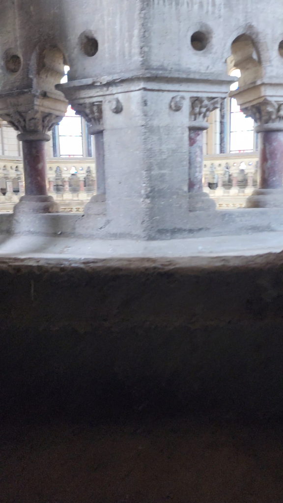 Heritage stone columns and architectural details inside CSMT Mumbai