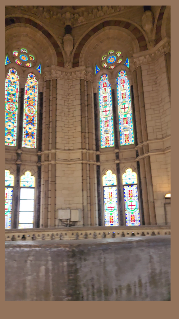 Stained glass windows and ornate heritage architecture inside CSMT Mumbai